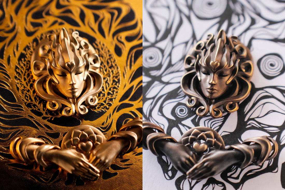 Antiqued Bronze Sovereign Dreamer and Helping Hands Pendants on gold foil and black ink art prints