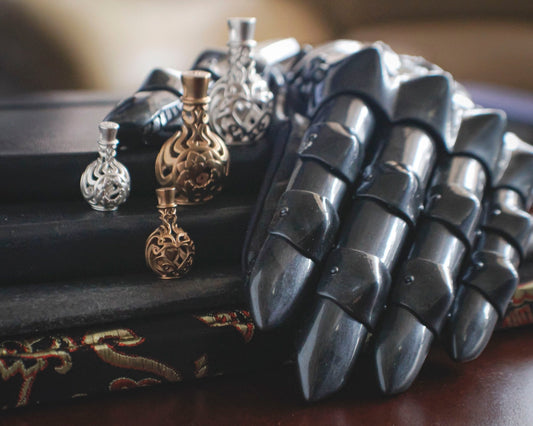Lumecluster Gauntlet and Vessel of Hope pendants in everdur bronze and sterling silver