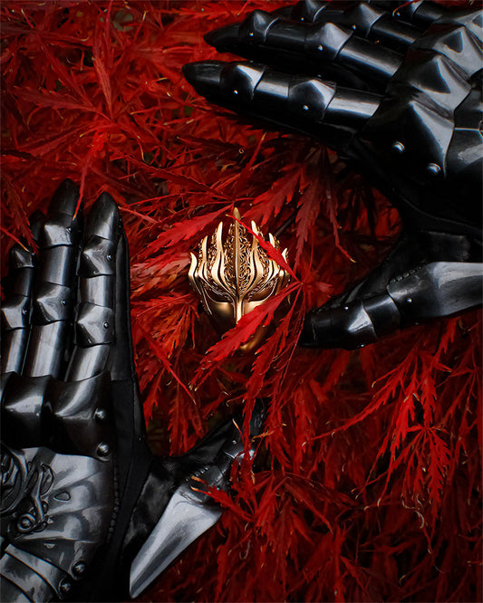 Phoenix Gauntlets and Bronze Sovereign Dreamer Brooch surrounded by maple